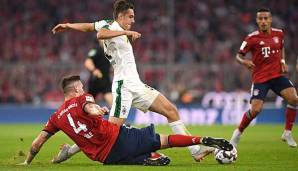 Gewann mit der Borussia in der Münchner Allianz Arena mit 3:0: Florian Neuhaus, hier im Zweikampf mit Niklas Süle vom FC Bayern.