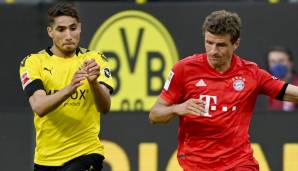 Achraf Hakimi im BVB-Trikot im Duell mit Thomas Müller.