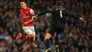 Thomas Vermaelen (l.) kam 2009 von Ajax Amsterdam zu den Gunners