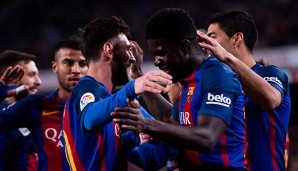 Samuel Umtiti (re.) und Lionel Messi (li.)