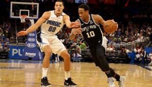 Aaron Gordon von den Orlando Magic verteidigt DeMar DeRozan von den San Antonio Spurs.