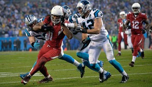 Larry Fitzgerald (l.) bleibt den Arizona Cardinals erhalten