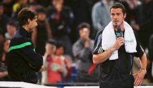 Marat Safin (r.) nach seiner Niederlage gegen Rafael Nadal 2009 in Peking